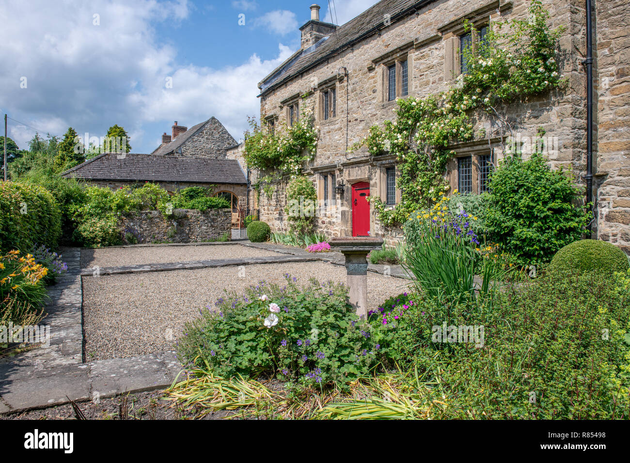 A bright red door marks the entrance to Kiplin Hall, Richmond, Yorkshire , UK Stock Photo