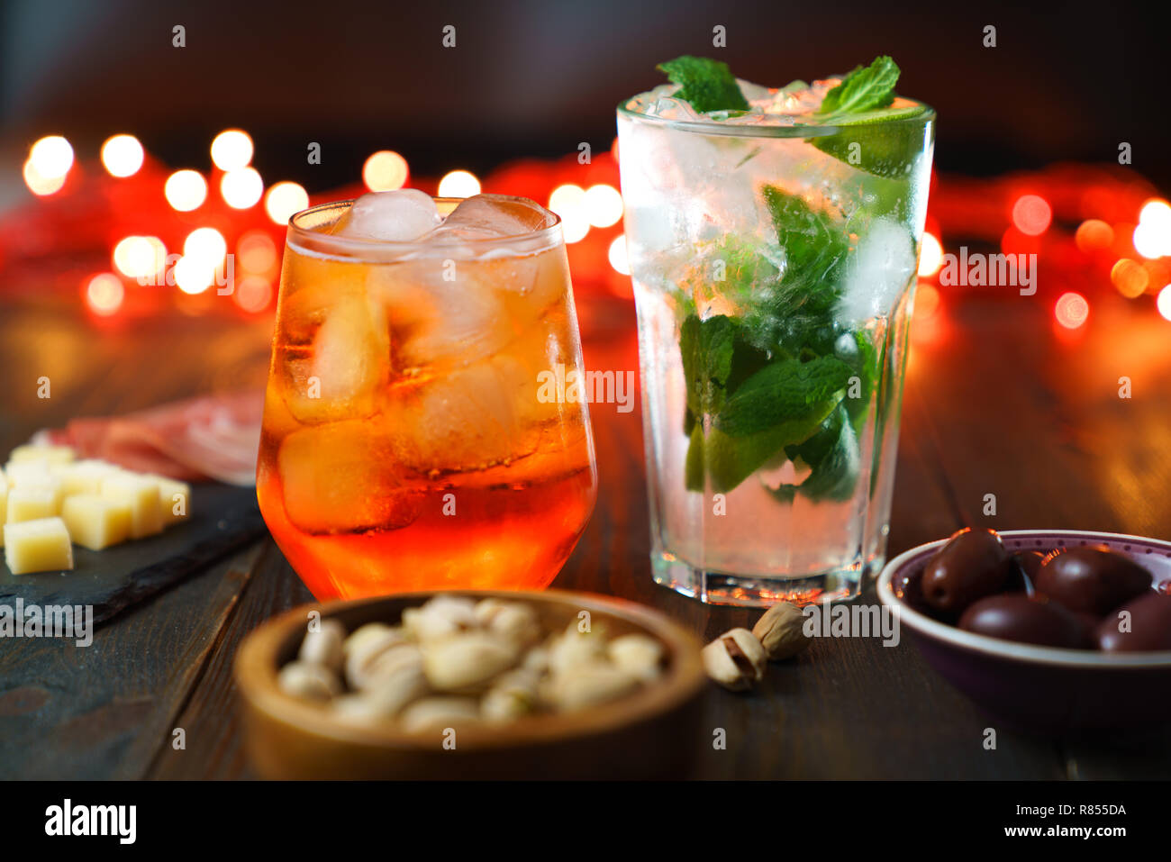 Happy hour with aperol spritz, mojito, prosciutto, olives, pistachios