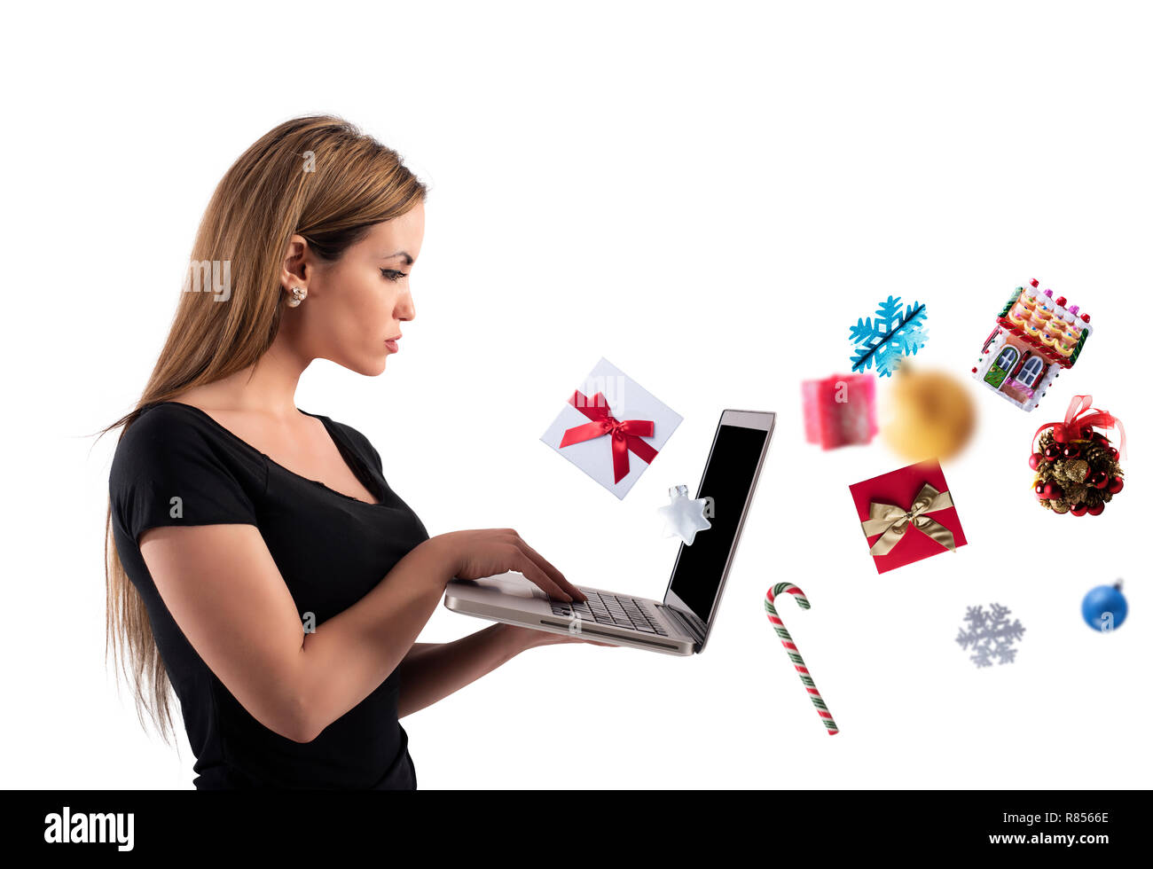 Girl orders Christmas gifts in a online shop Stock Photo