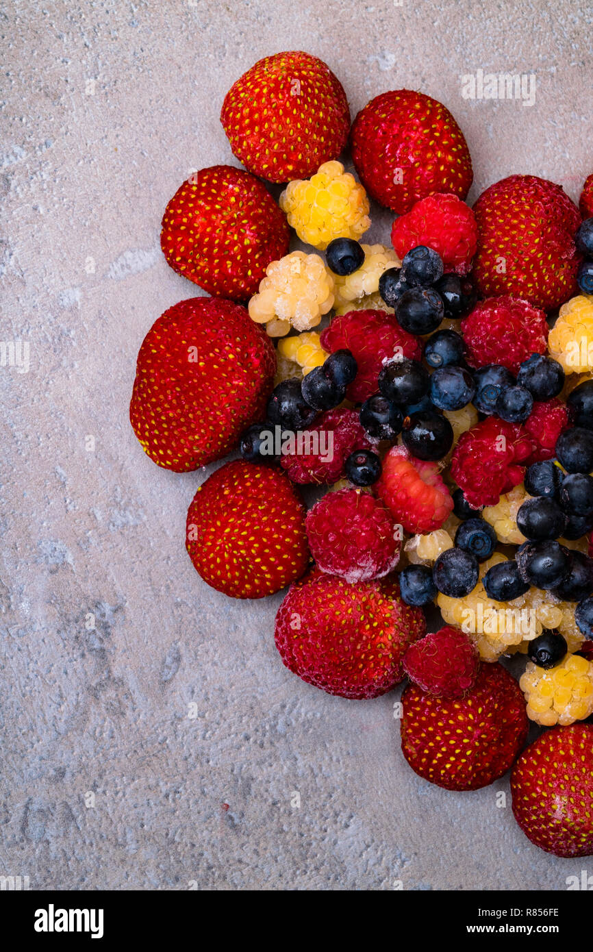 resveratrol rich berry, strawberry, blueberry, raspberry on stone background, food for health