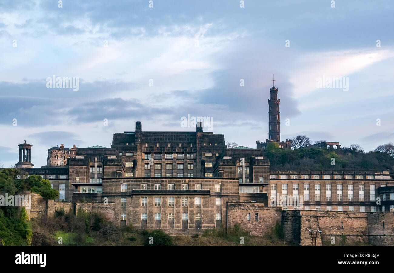 Edinburgh grand buildings in Winter dawn. St Andrews House, Scottish Government headquarters, and Calton Hill monuments, Scotland, UK Stock Photo