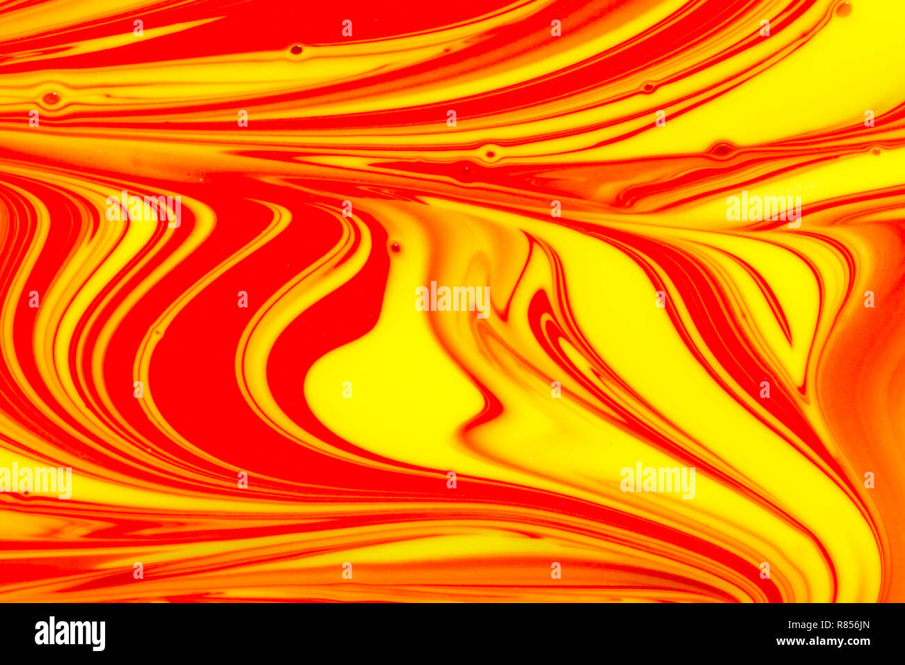 Abstract background of red, orange and yellow swirls of liquid pant Stock  Photo - Alamy