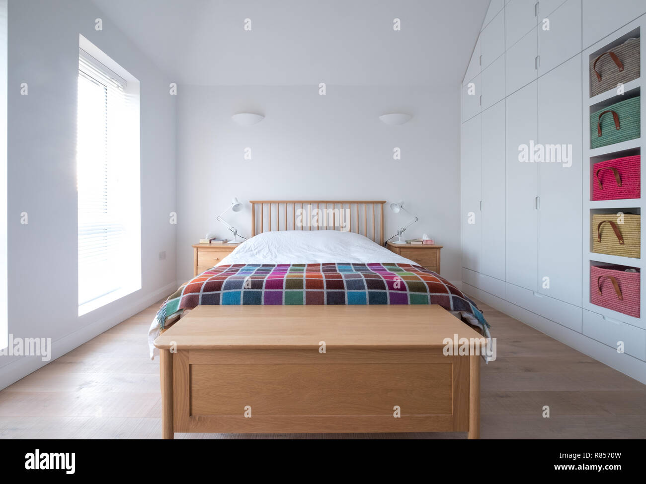 Scandi style, minimalist, uncluttered bedroom interior with wooden