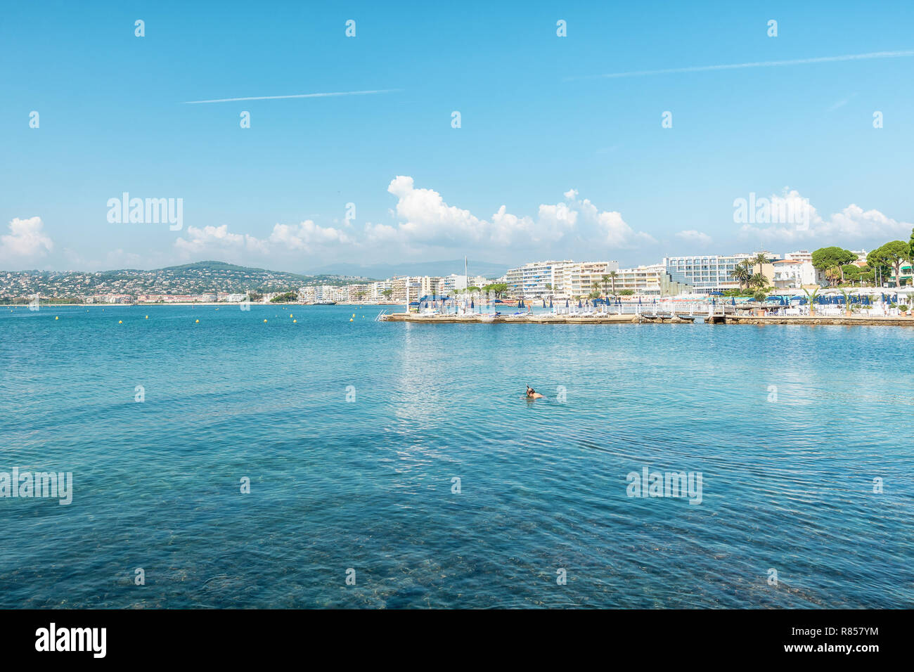 Juan-les-Pins, France, September 19, 2018: Snorkeler in the Golfe Juan with in the background the hotels of the French city of Juan-les-Pins Stock Photo