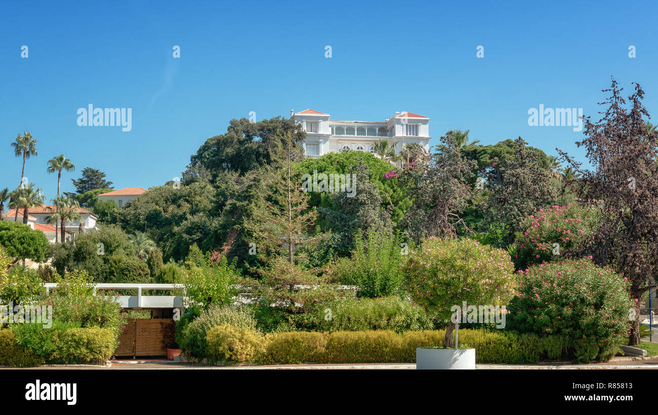 Juan-les-Pins, France, September 19, 2018: Beautiful white villa on the hill in the beach resort of Juan-les-Pins in France Stock Photo