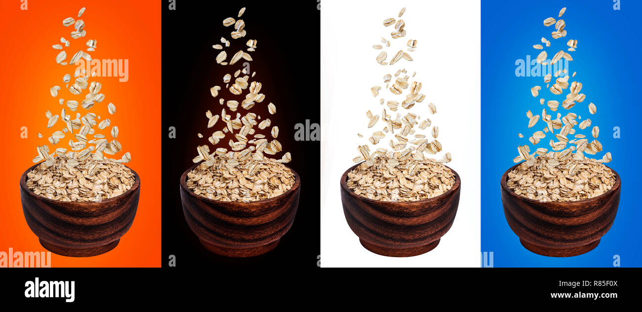 Oat flakes falling in bowl, isolated on white, black, color backgrounds, flying oats packaging concept, oatmeal grains Stock Photo