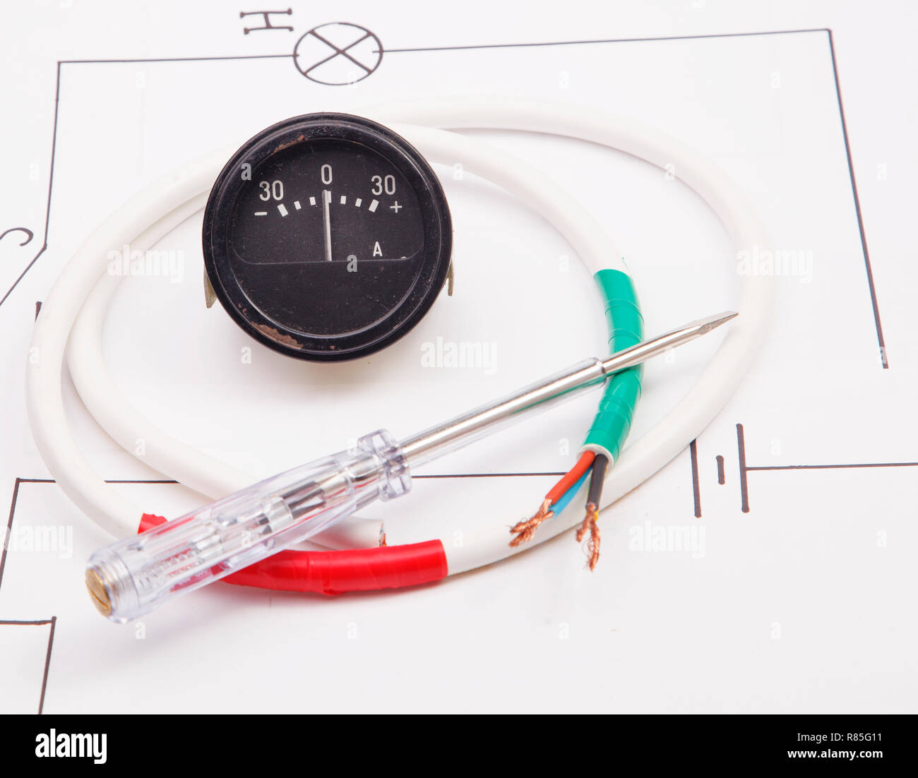 Ammeter and  and  lectric screwdriver on a background of the electric scheme Stock Photo