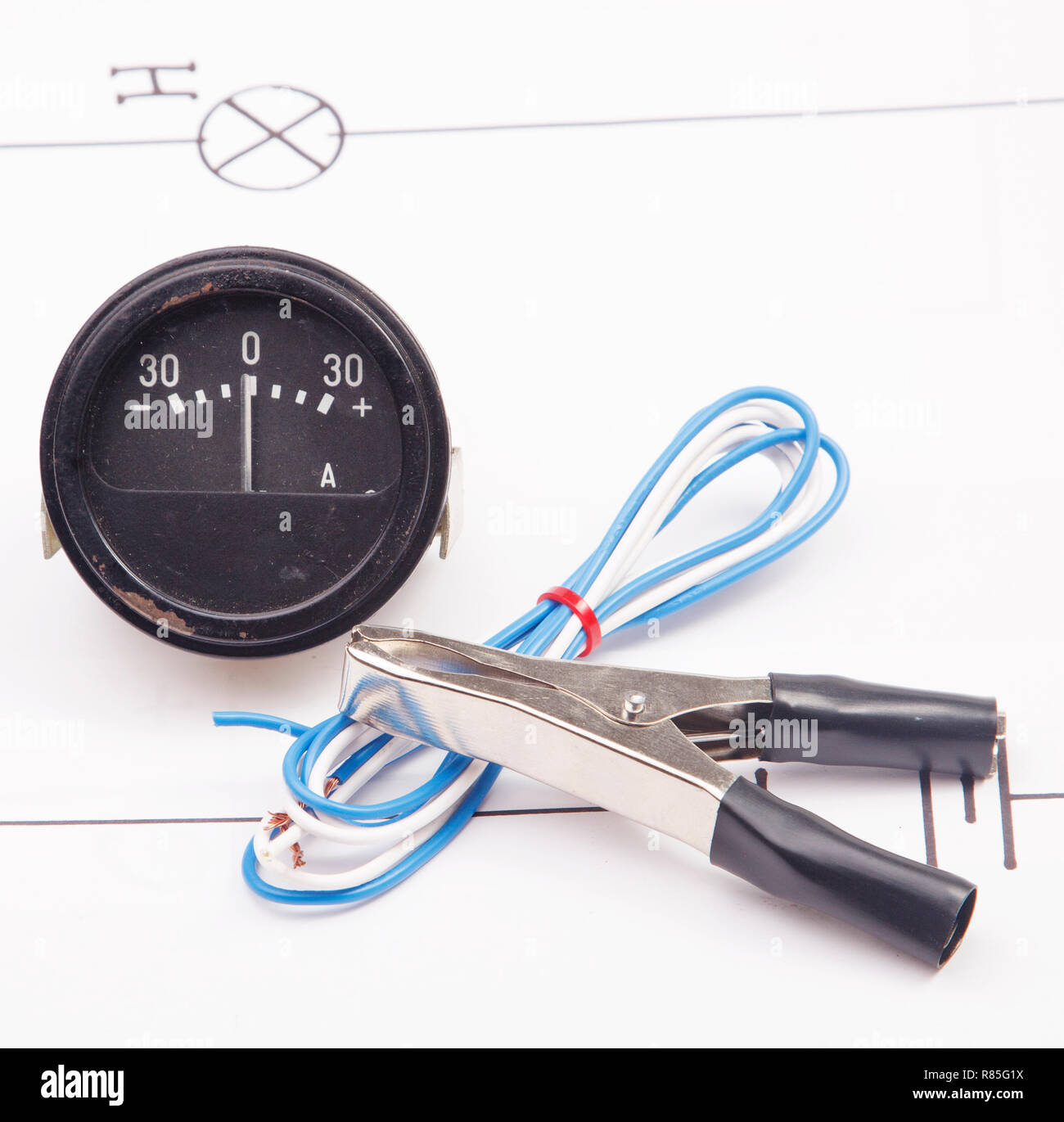 Ammeter and electric clamps  on a background of the electric scheme Stock Photo