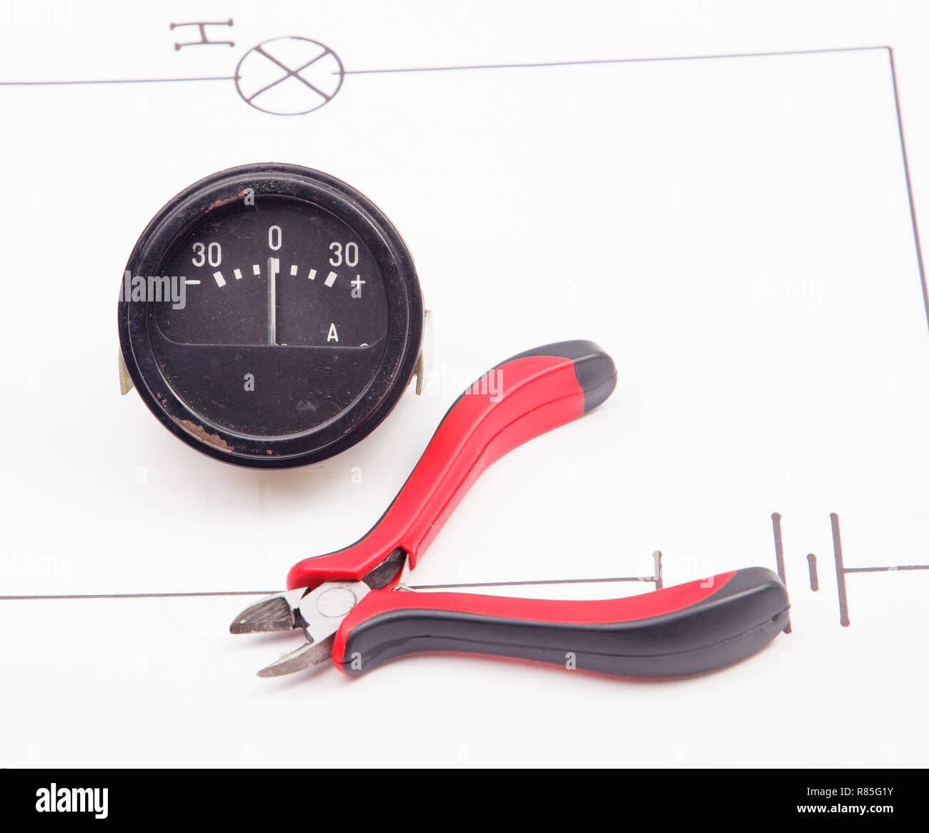 Ammeter and  on a background of the electric scheme Stock Photo