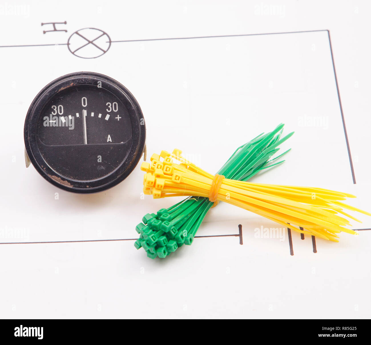 Ammeter and electric wire on a background of the electric scheme Stock Photo