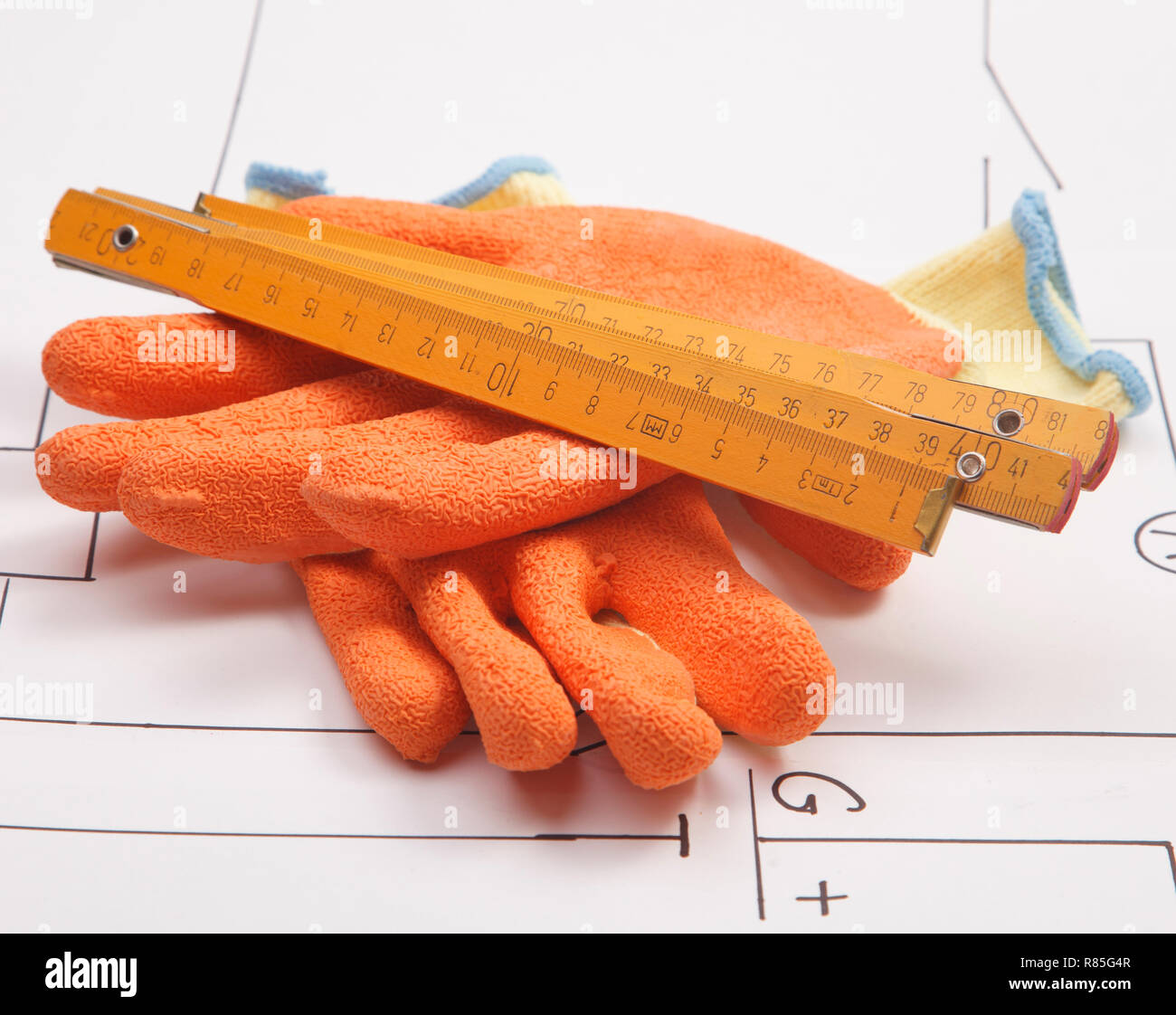 mounting gloves and wooden ruler Stock Photo - Alamy