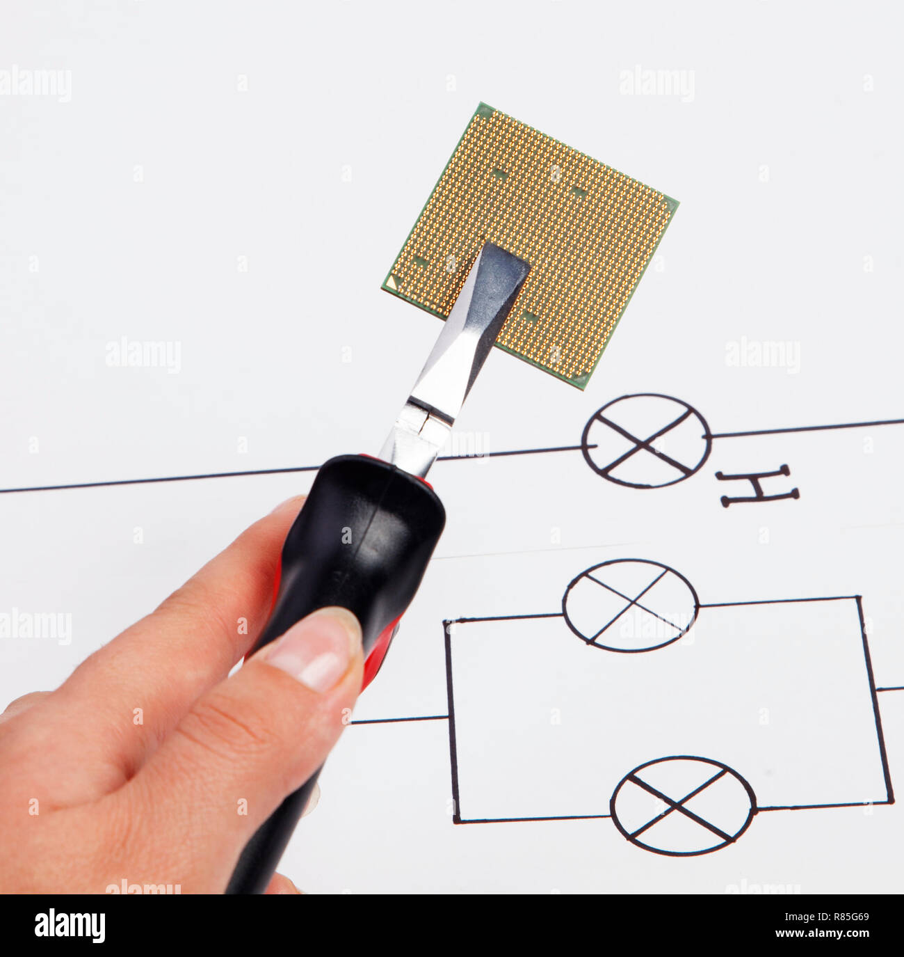 Modern central computer processors CPU clamped in the pliers Stock Photo