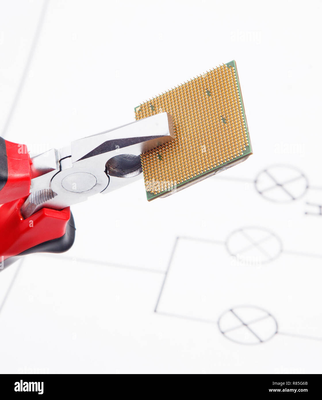 Modern central computer processors CPU clamped in the pliers Stock Photo