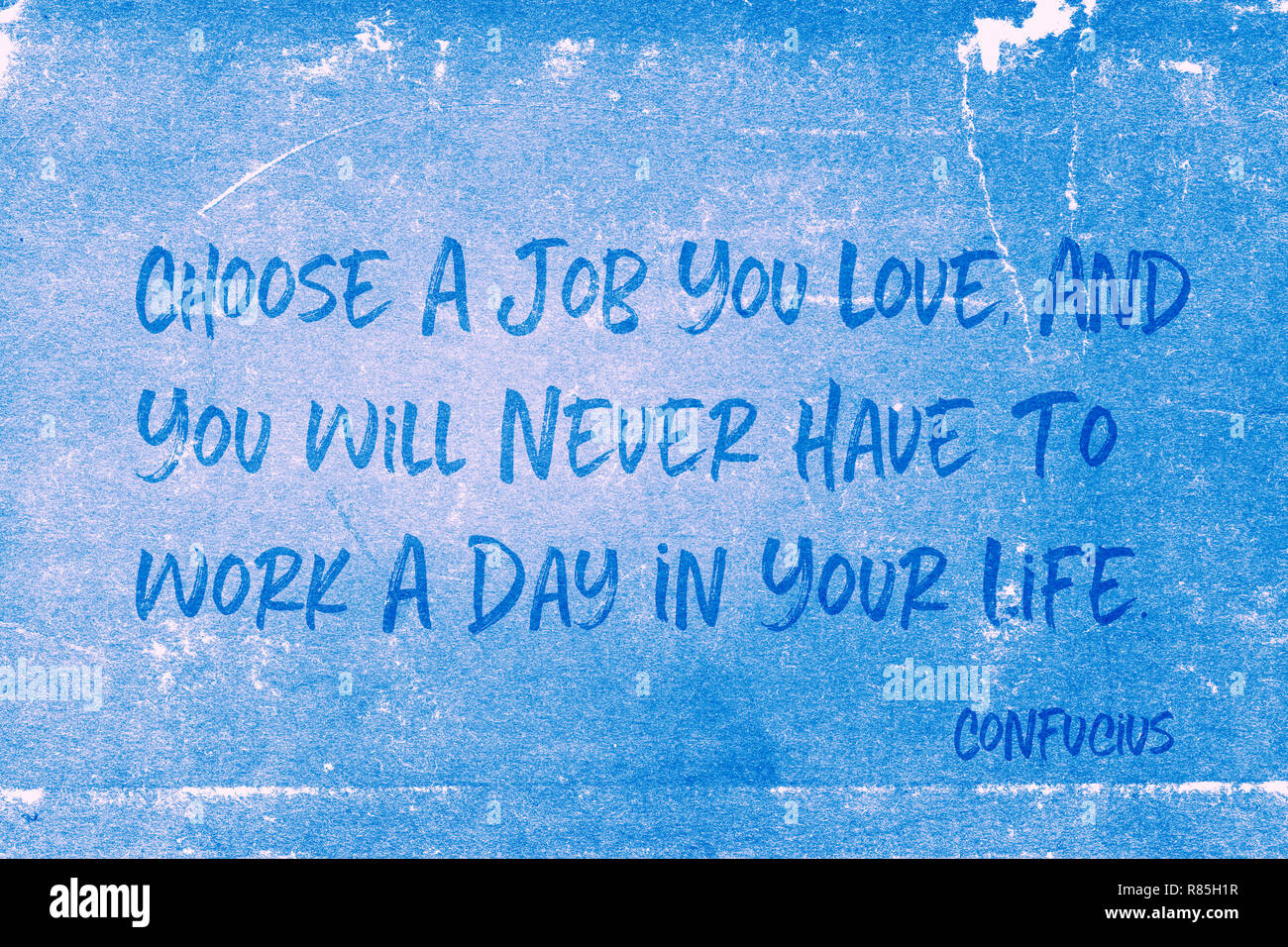 Choose a job you love, and you will never have to work a day in your life - ancient Chinese philosopher Confucius quote printed on grunge blue paper Stock Photo