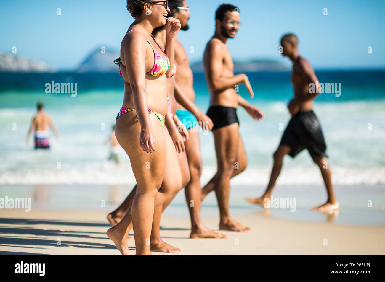 RIO DE JANEIRO - FEBRUARY, 2018: Young Brazilians walk together on Ipanema  Beach, which has a reputation for fit bodies in skimpy swimwear Stock Photo  - Alamy