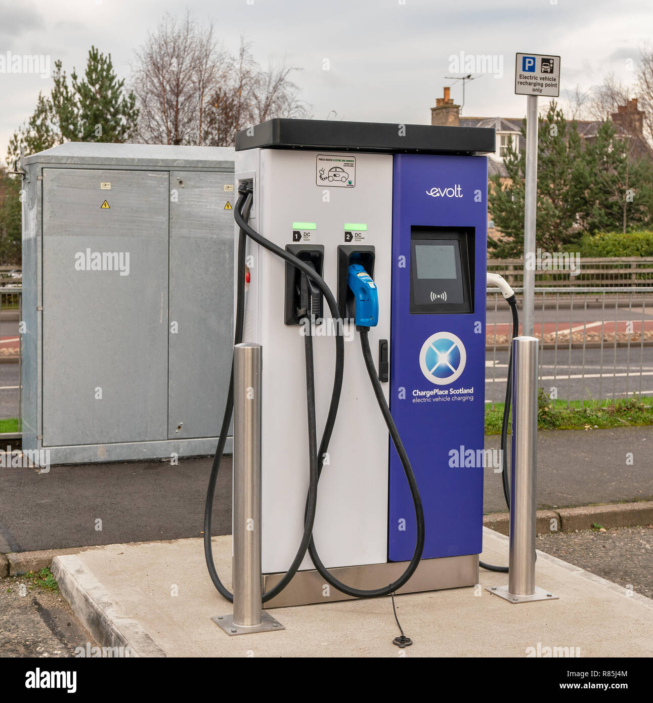This a vehicle being charged at a Car Park in Elgin, Moray, Scotland run by ChargePlace Scotland - https://chargeplacescotland.org/. Photographed by J Stock Photo