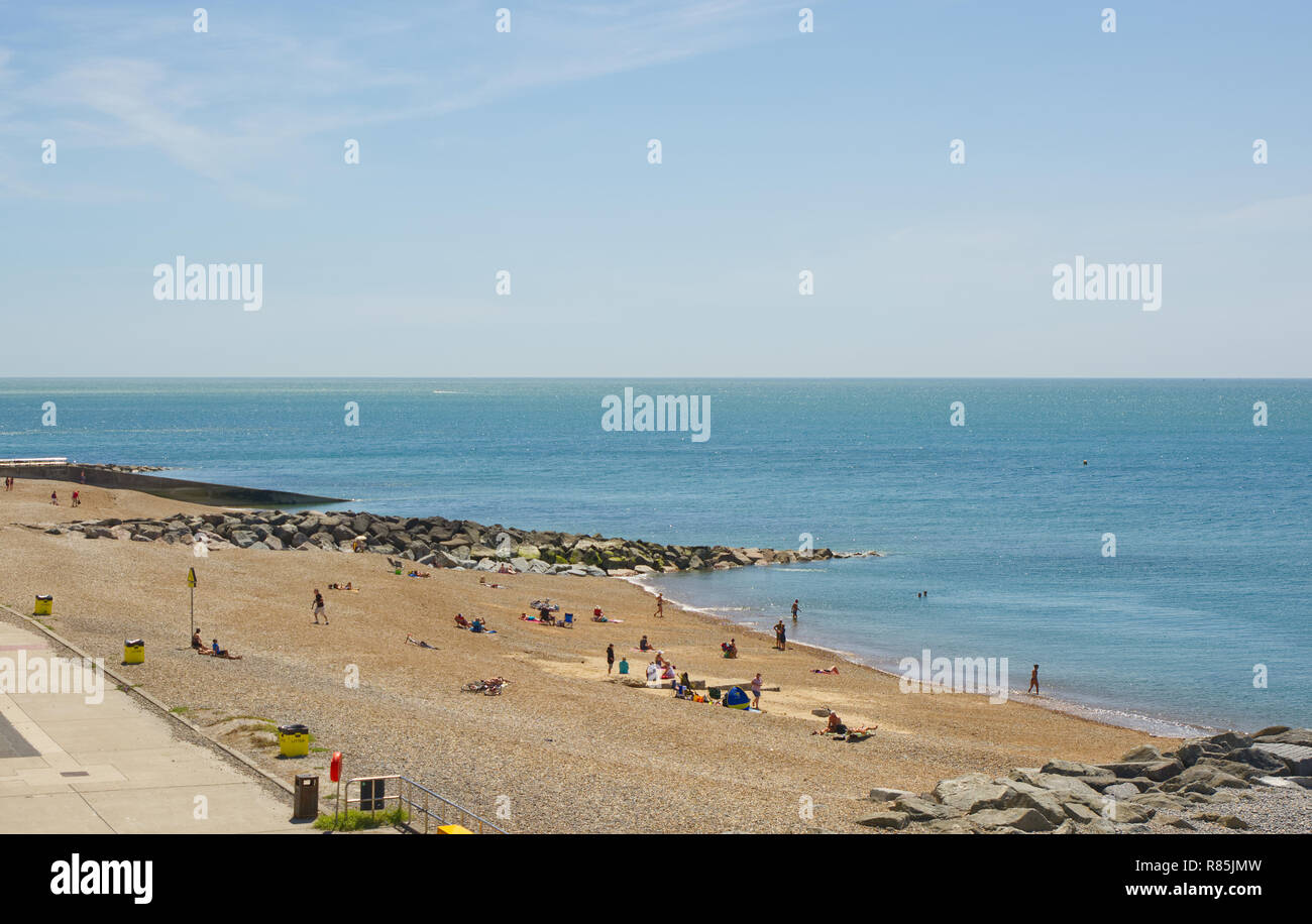 Beach with people at Rottingdean near Brighton, East Sussex, England Stock Photo