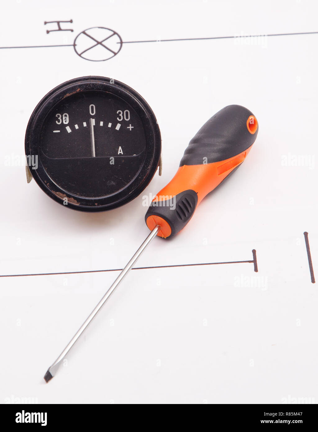 Ammeter and  and electric screwdriver on a background of the electric scheme Stock Photo