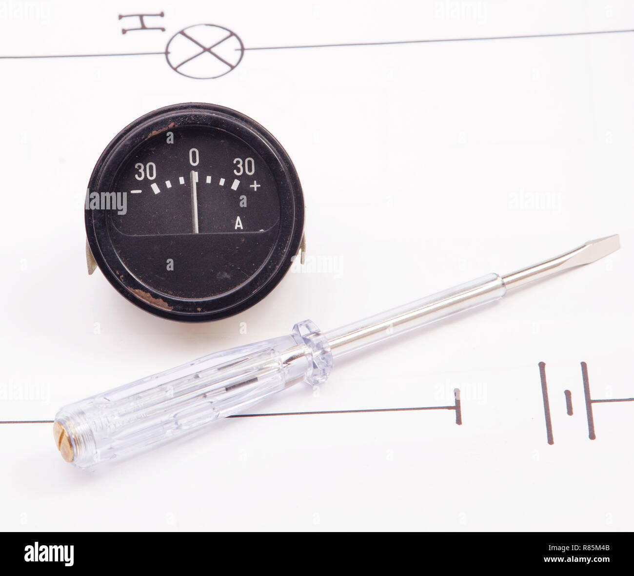 Ammeter and  and  lectric screwdriver on a background of the electric scheme Stock Photo