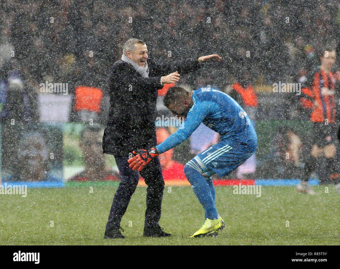 Kiev, Ukraine. 13th Dec, 2018. Lyon head coach Bruno Genesio and goalkeeper of Lyon Anthony Lopes are seen celebrating after the UEFA Champions League Group F football match between Shakhtar Donetsk and Lyon at the NSK Olimpiyskyi in Kiev. Credit: Vadim Kot/SOPA Images/ZUMA Wire/Alamy Live News Stock Photo