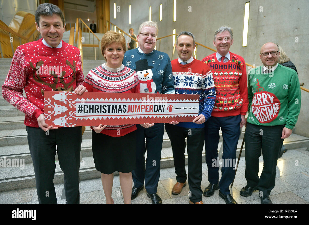 Save the Children's Christmas Jumper Day 2018. PICTURED L-R  at the Scottish Parliament with their Christmas jumpers on are Ken Macintosh msp,  Presiding Officer of the Scottish Parliament, First Minister Nicola Sturgeon (SNP), Jackson Carlaw  Scottish Conservative Deputy Leader, Alex Cole Hamilton MSP, Liberal Democrat, Richard Leonard  leader Scottish Labour Party and Patrick Harvie  co-convener of the Scottish Green Party. Stock Photo
