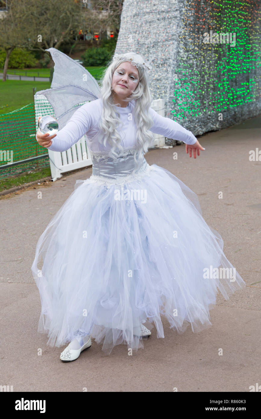 Bournemouth, Dorset, UK. 13th Dec 2018. The Winter Fairy with her crystal  ball brings a touch of ethereal magic as she roams around Bournemouth  Gardens leaving those she meets spellbound. Credit: Carolyn