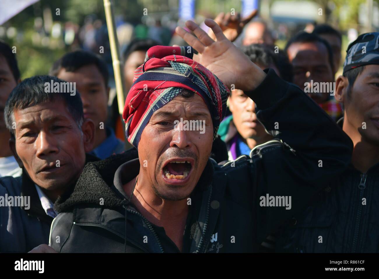 Agartala, Tripura, India. 10th Dec, 2018. A protester seen chanting slogans during the protest.INPT (Indigenous Nationalist Party of Twipra) leaders and supporters protest on the National High way in Khamtingbari, 40 km far from Agartala city to demand for the withdrawal of Citizenship Bill that was Introduced in July 19 in Lok Sabha, the Citizenship Amendment Bill 2016 seeks to allow illegal migrants from certain minority communities in Afghanistan, Bangladesh and Pakistan eligible for Indian citizenship. In other words, it amends the Citizenship Act of 1955. (Credit Image: © Abhisek Sa Stock Photo