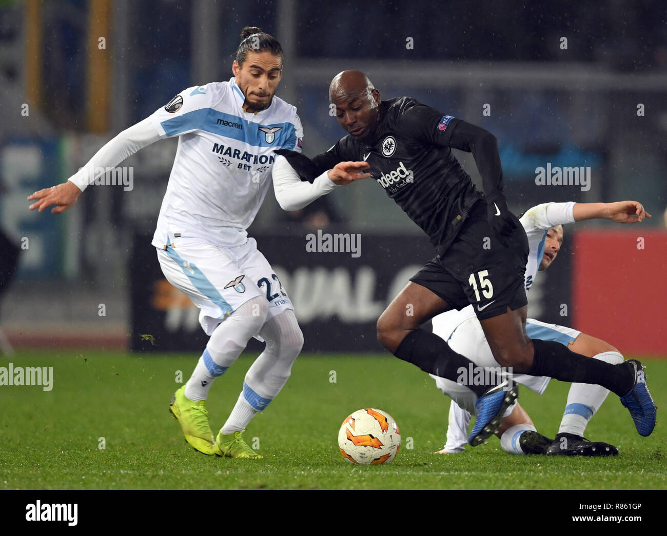 Rom, Italy. 13th Dec, 2018. Soccer: Europa League, Lazio Rome - Eintracht Frankfurt, Group stage, Group H, 6th matchday in the Olympic Stadium. Rome's Martin Caceres (l) and Alessandro Murgia (r) and Frankfurt's Jetro Willems fight for the ball. Credit: Arne Dedert/dpa/Alamy Live News Stock Photo