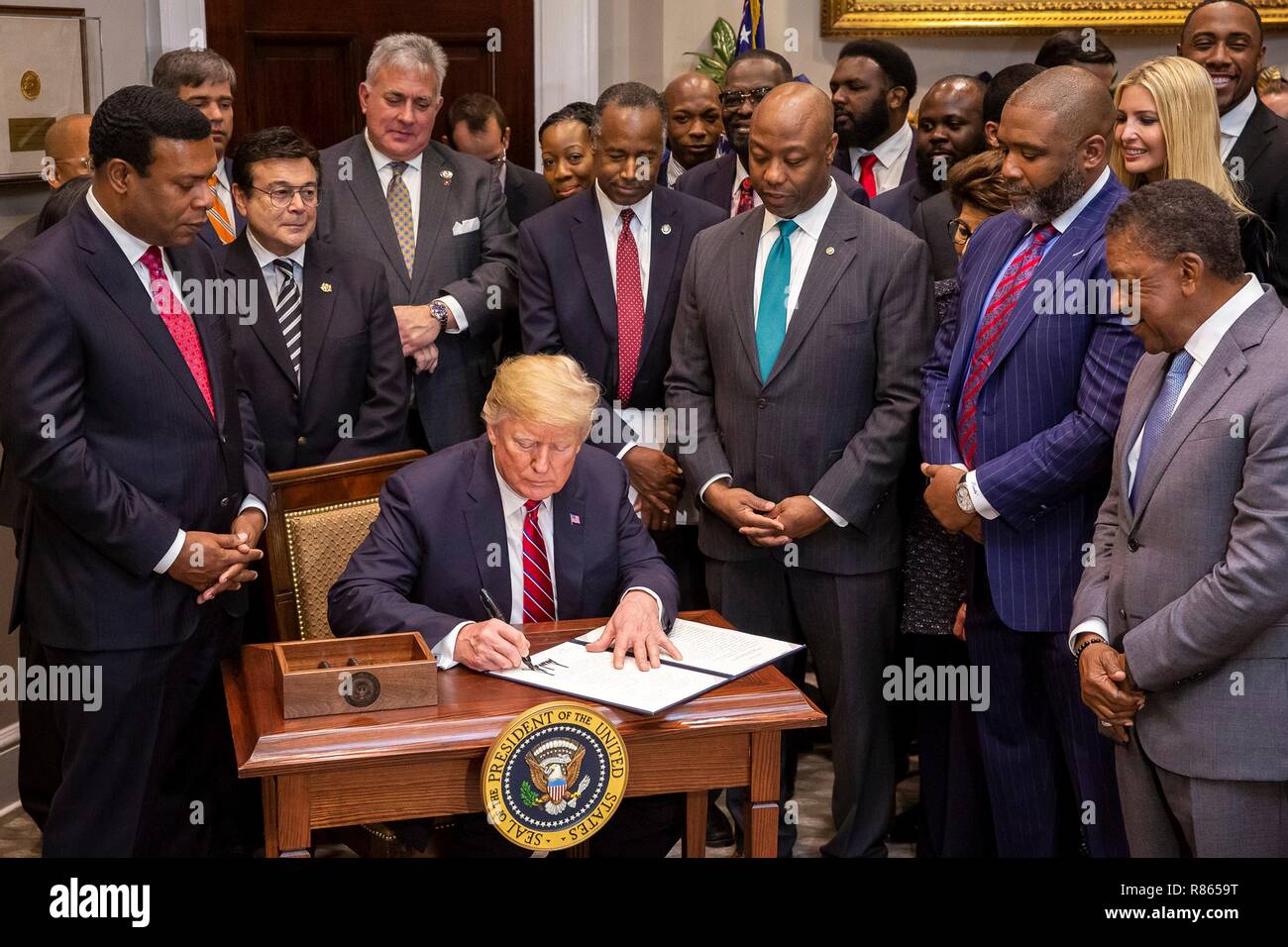 U S President Donald Trump Surrounded By Cabinet And Congressmen