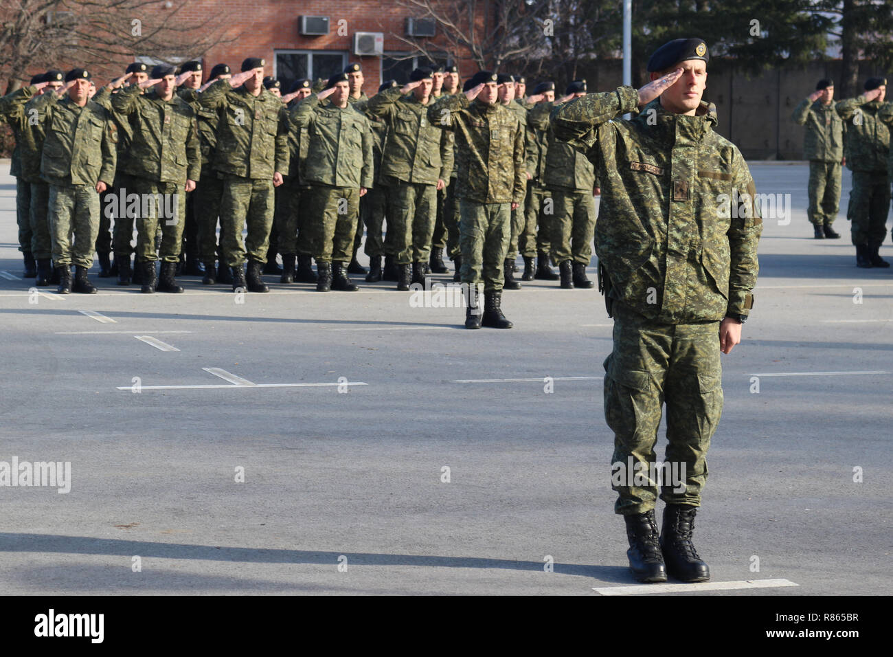 13 December 2018, Kosovo, Gnjilane: A battalion of the Kosovo Security Forces (KSF) is standing in one place at the flag roll call. On December 14, the Kosovo parliament wants to take the decision to transform the KSF disaster control force into an army. Serbia is vehemently critical of the move, and Nato foreign ministers recently also spoke of a decision that did not come at the right time. The government of Kosovo, on the other hand, points out that the development of its own defence forces has been a process that has been going on for years and is supported by NATO partners with training a Stock Photo