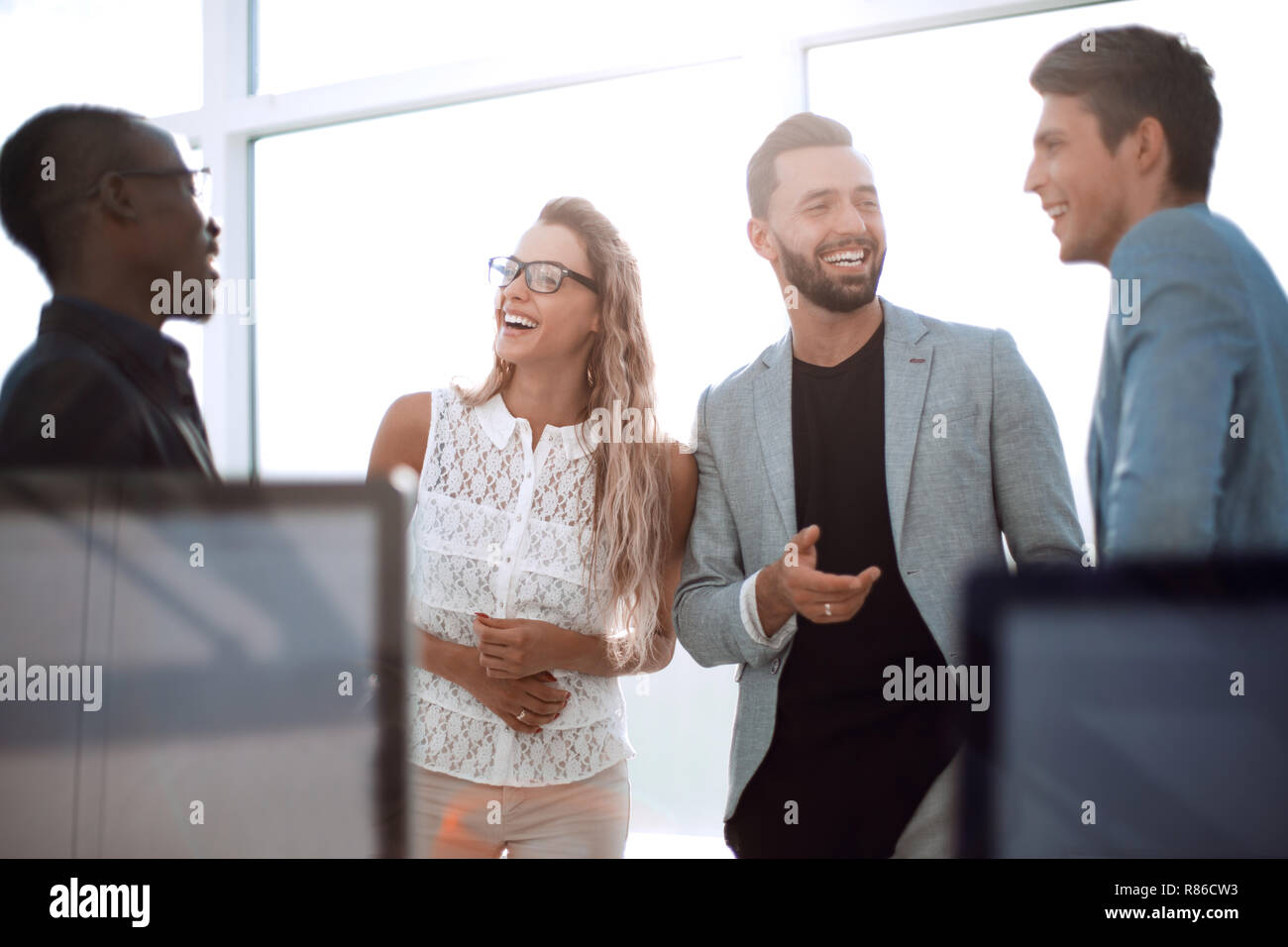 business colleagues talking standing in the office Stock Photo - Alamy