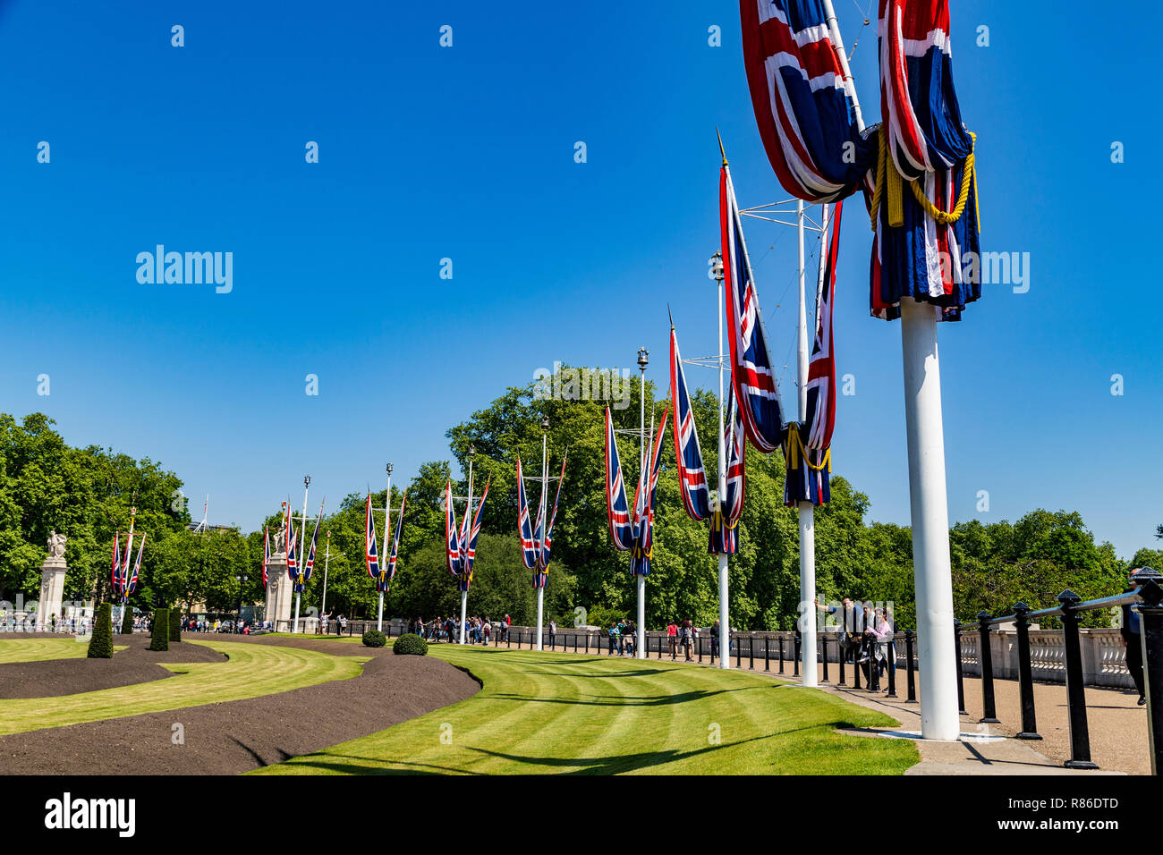 A view of UK flags around Buckingham palace in London, England Stock Photo