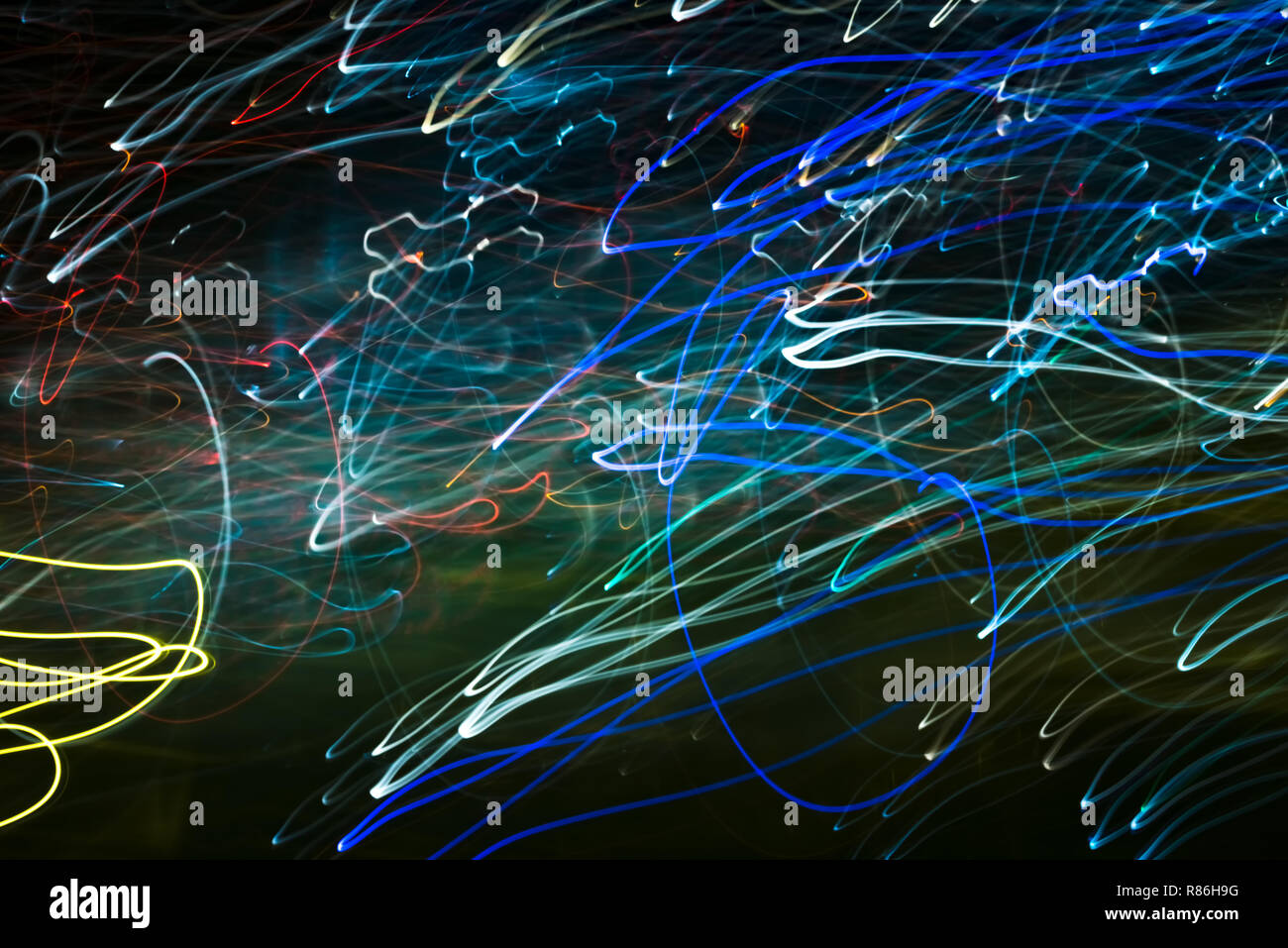Bright abstract spiral patterns from light strips on a black background Stock Photo