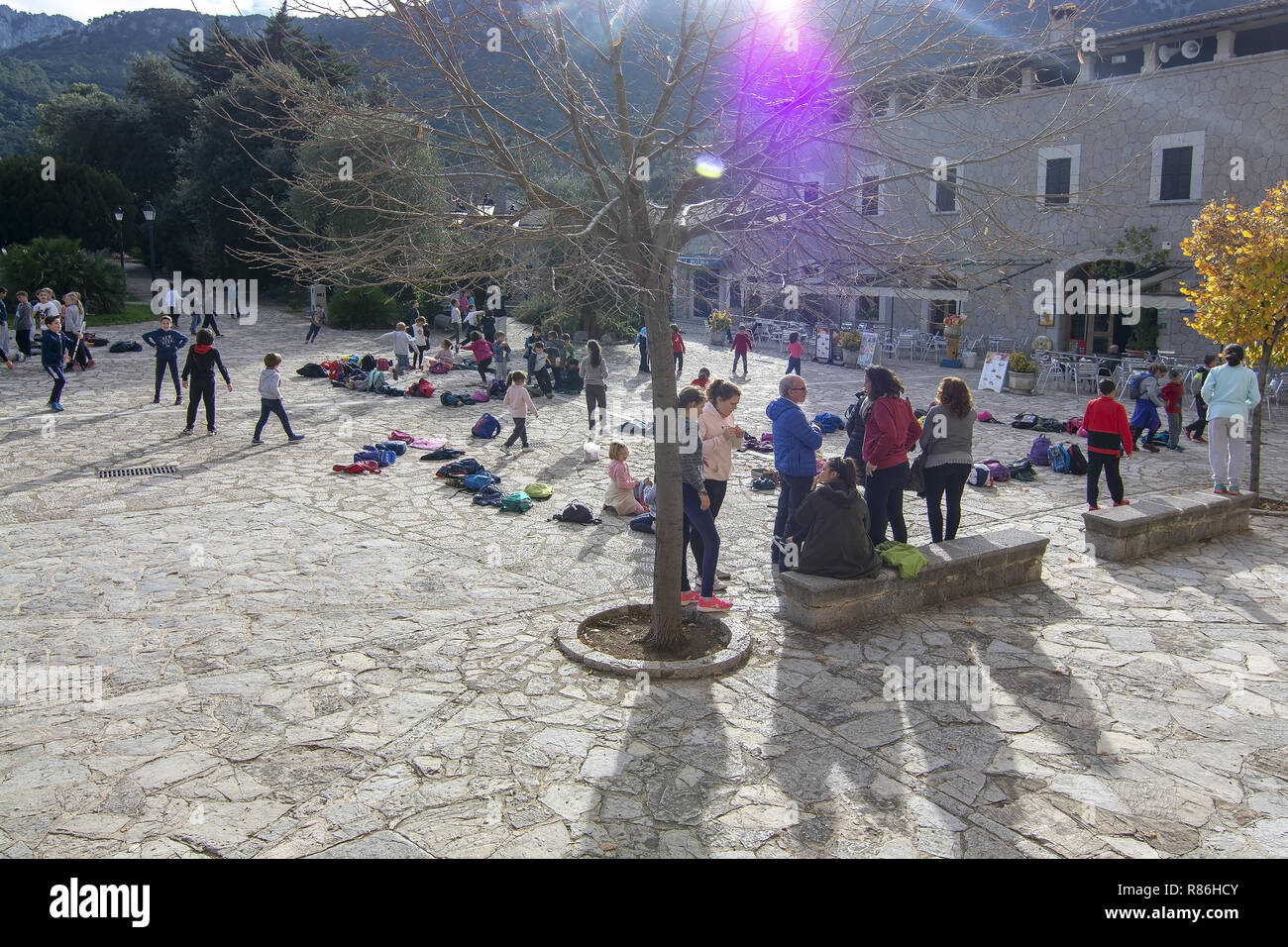 LLUC, MALLORCA, SPAIN - DECEMBER 3, 2018: School children playing in the yard on a day out to the monastery on a sunny day on December 3, 2018 in Lluc Stock Photo