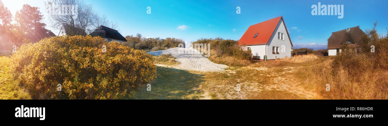 Traditional houses and entrance to the beach, Vitte village on island of Hiddensee, off the Baltic coast of Northern Germany, panoramic image Stock Photo