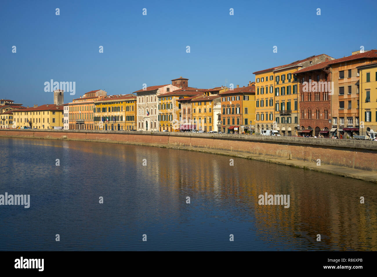 Pisa, Italy: River Arno and north bank in morning sunshine Stock Photo