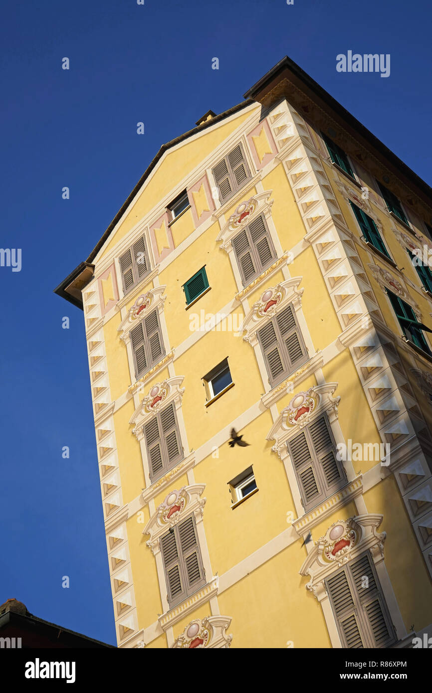 Camogli, Liguria, Mediterranean, Italy: trompe l'oeil windows and shutters on tall house Stock Photo