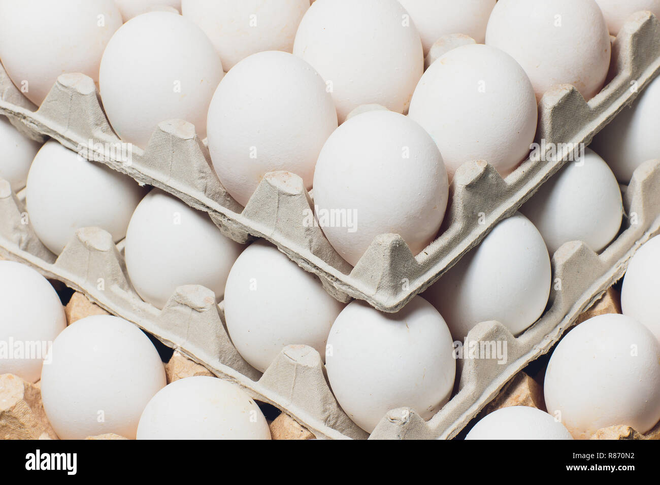 Several white eggs in an egg carton Stock Photo Alamy