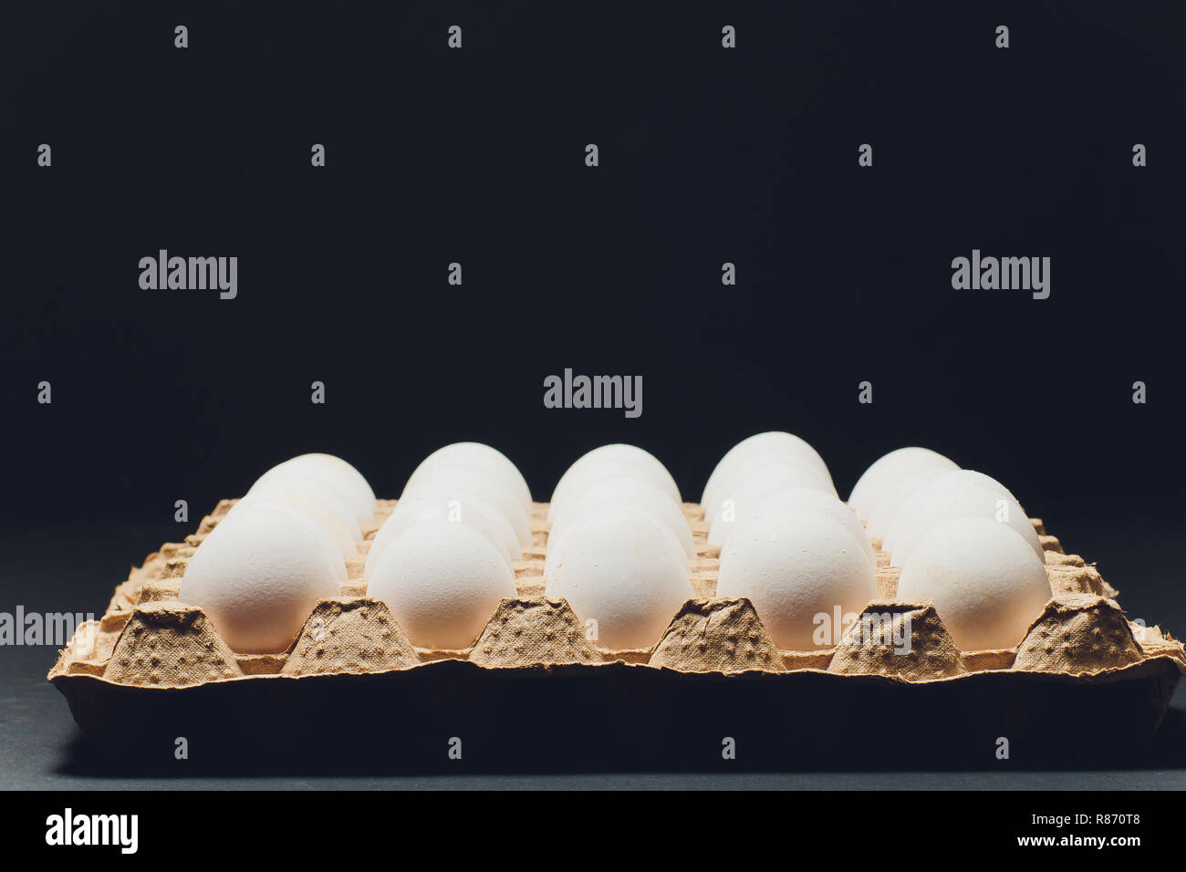 Several white eggs in an egg carton Stock Photo Alamy