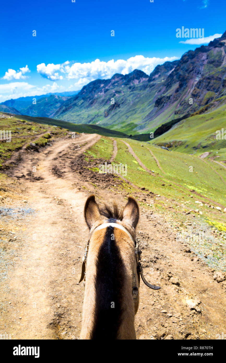 Riding a horse up the Rainbow Mountain (Vinicunca), Peru Stock Photo