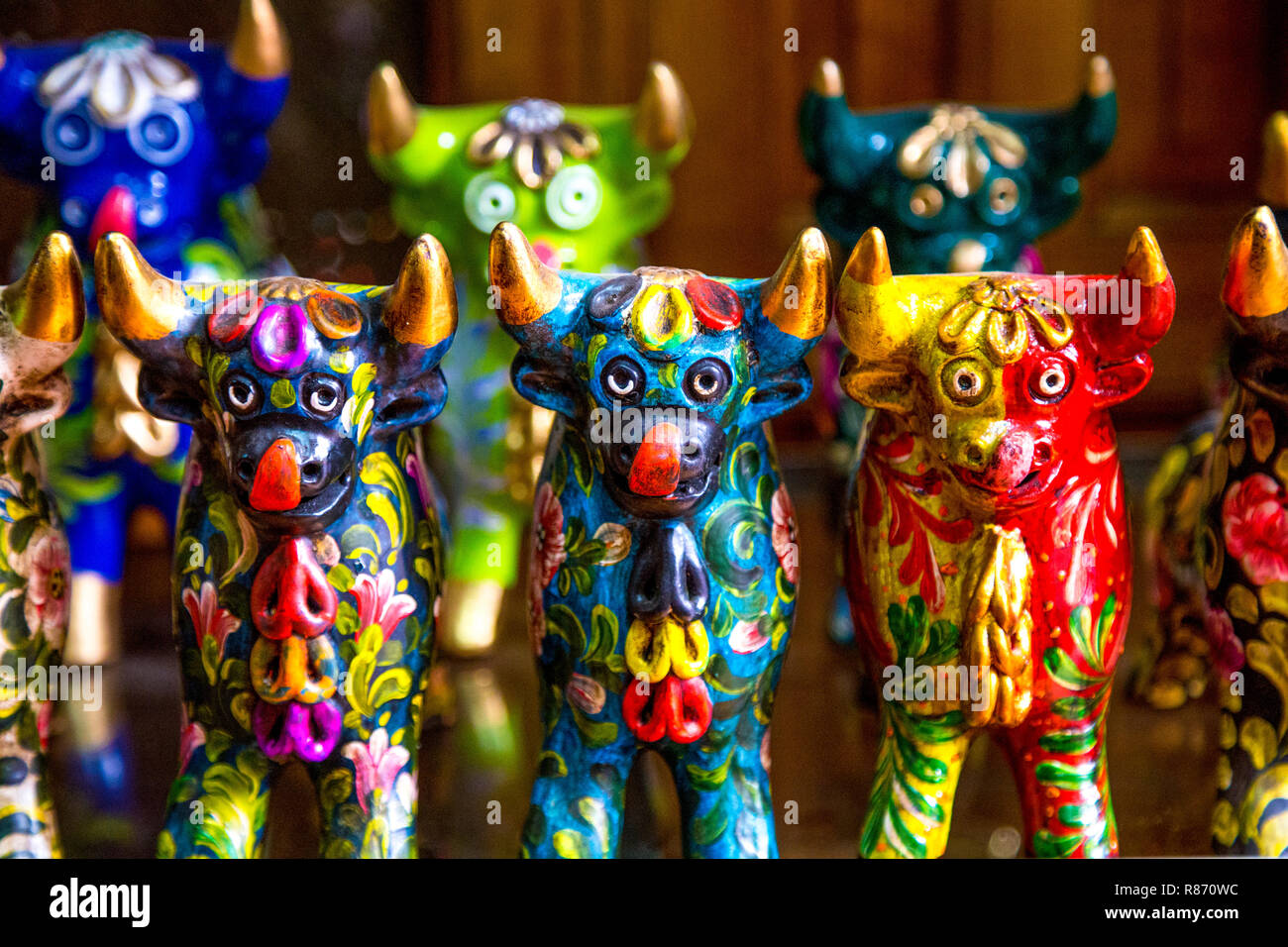Stall with souvenir bull figurines at Pisac market in the Sacred Valley, Peru Stock Photo