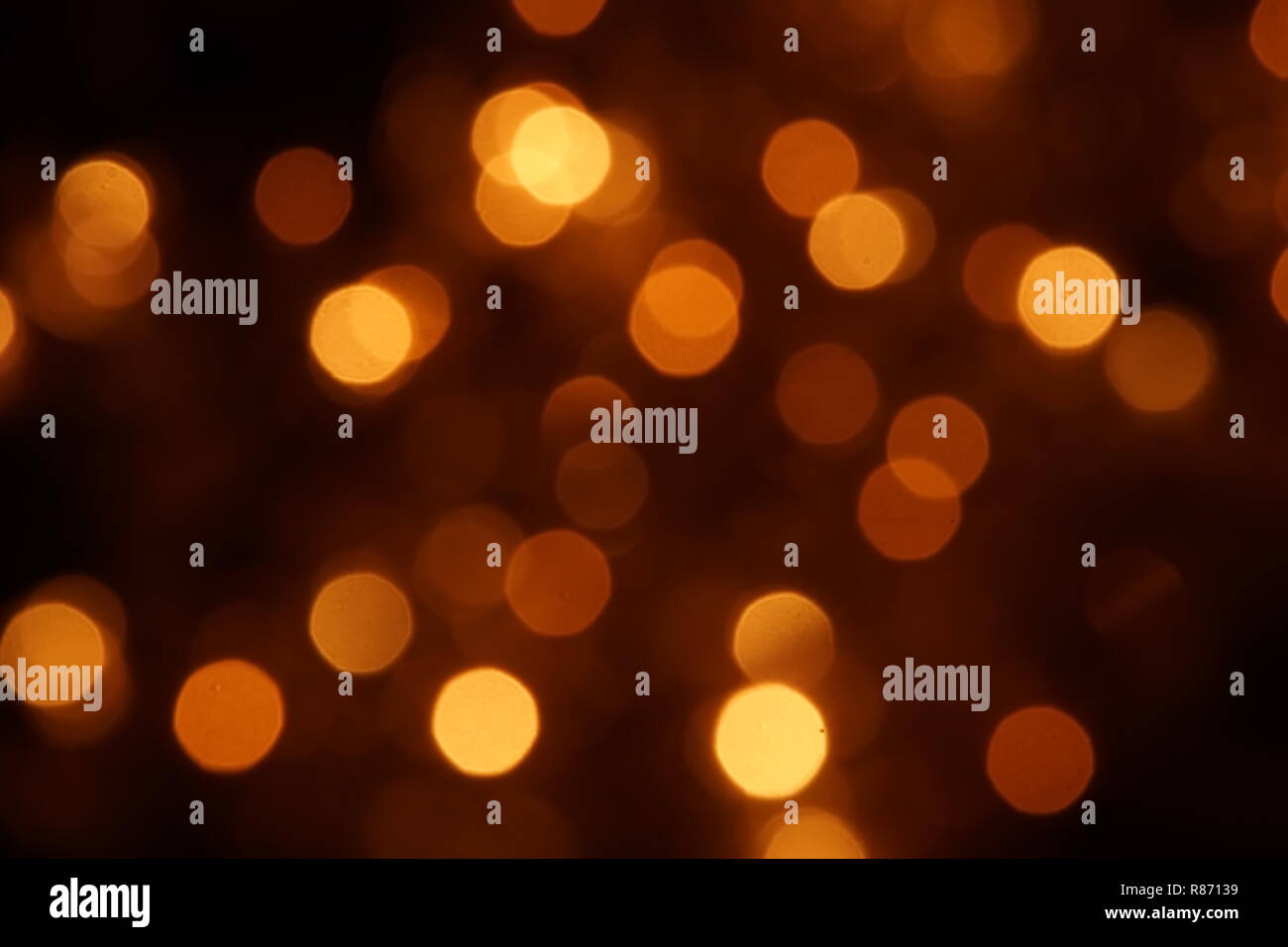 natural bokeh holiday lights background for design gold Stock Photo - Alamy