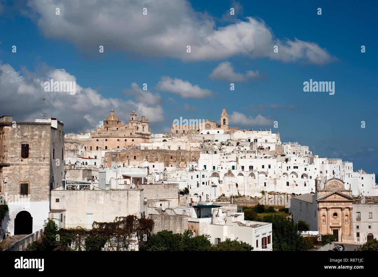 The picturesque old town of Ostuni in southern Italy, built on top of a hill and crowned by its Gothic Basilica or Cathedral. Stock Photo