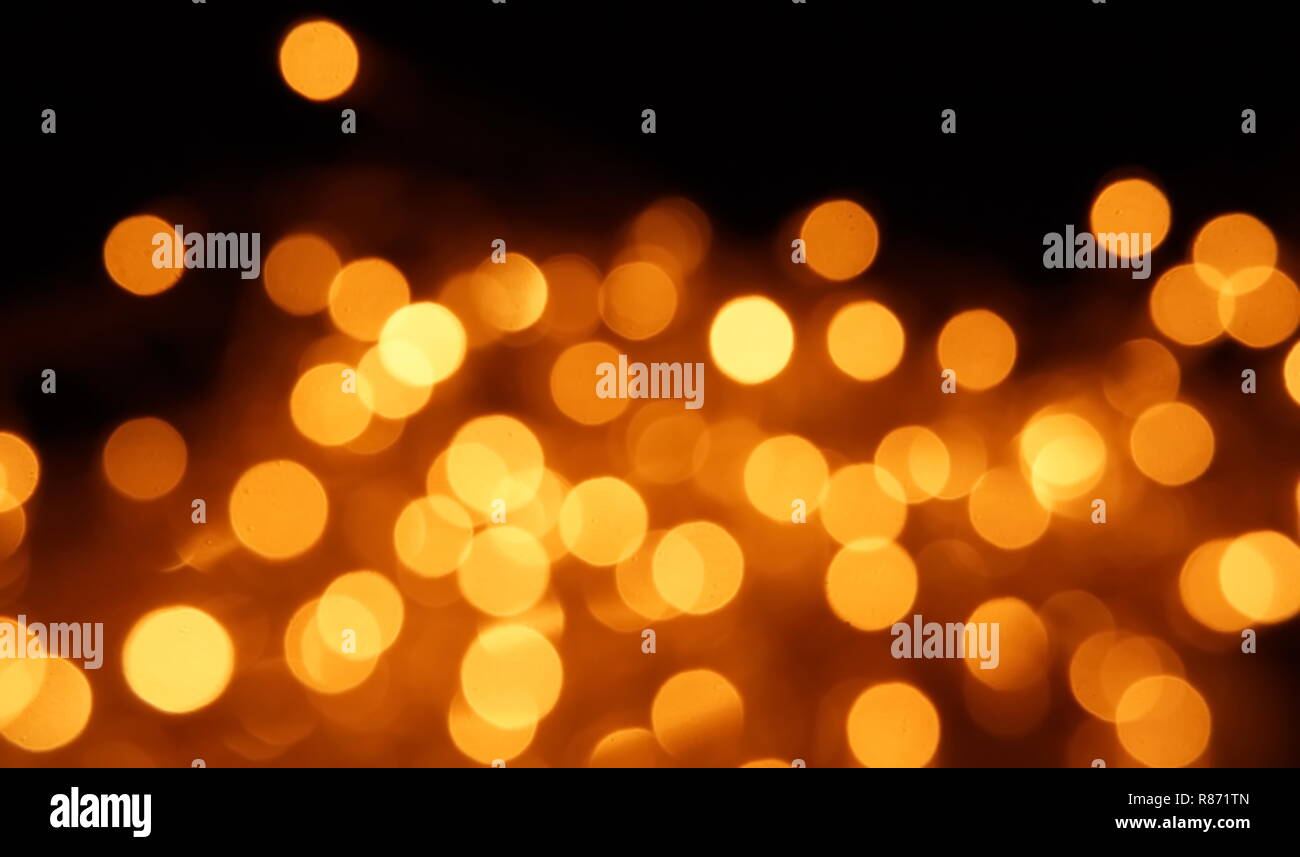 natural bokeh holiday lights background for design gold Stock Photo - Alamy