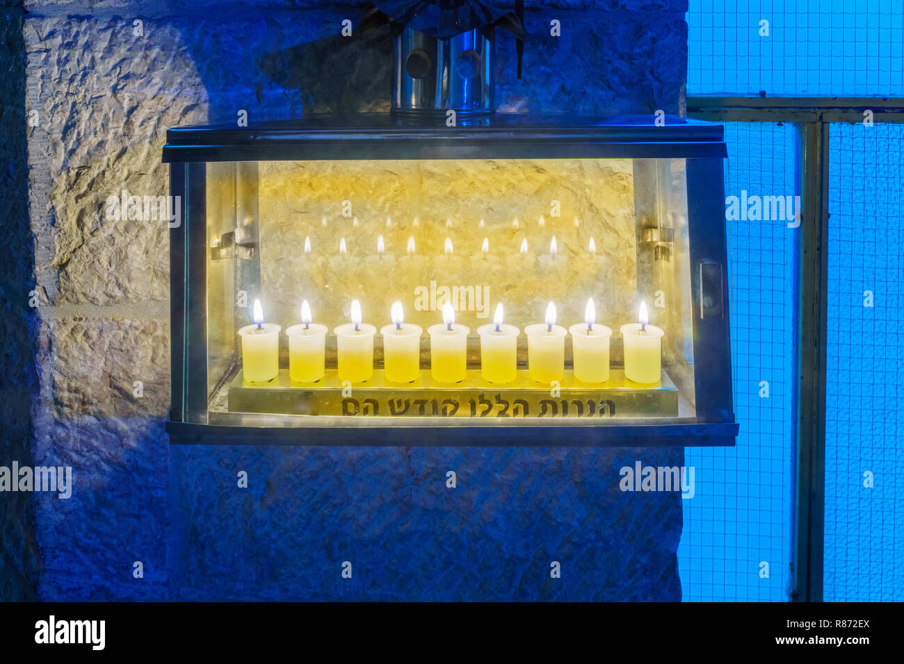 Traditional Menorah (Hanukkah Lamp), with olive oil candles in the