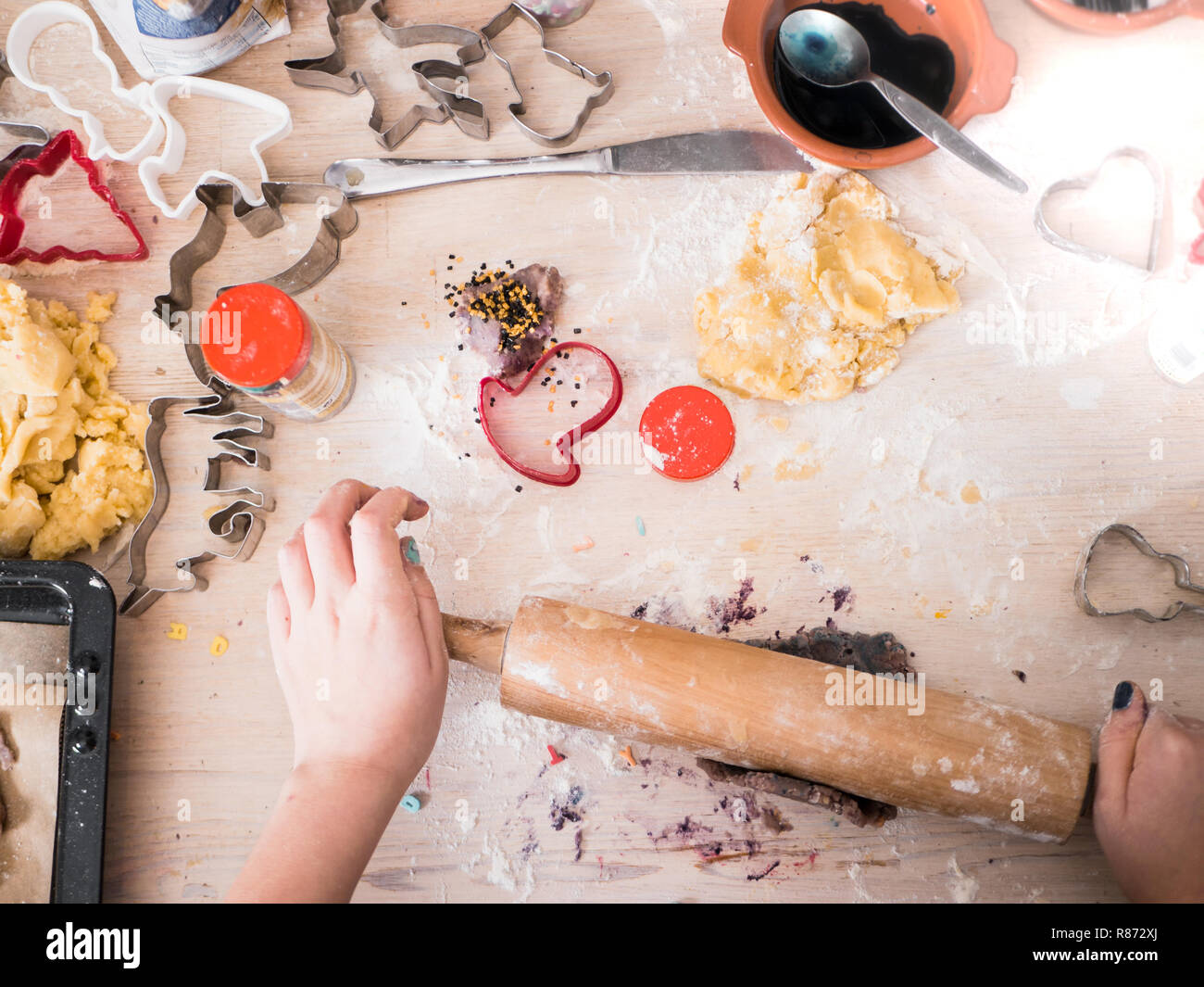 Christmas Bakery Little Girl Rolling Cookie Dough Top View With Different Baking Supplies Stock Photo Alamy