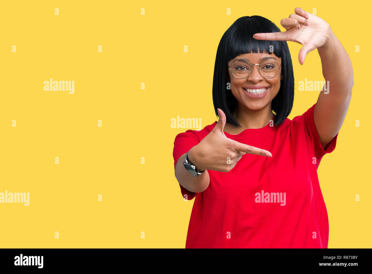 Beautiful young african american woman wearing glasses over isolated ...