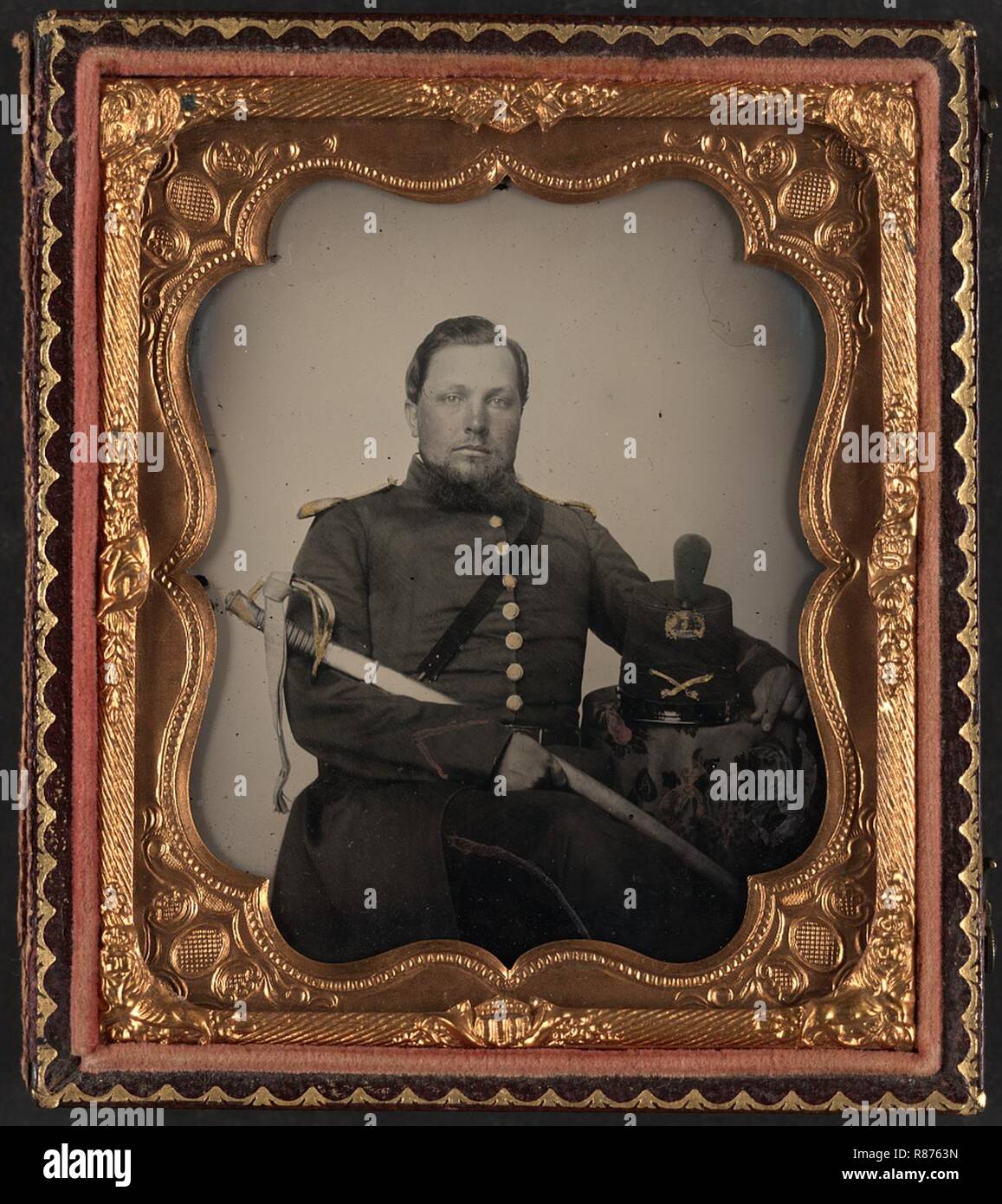 Captain Robert Emmet Robinson of Petersburg Light Dragoons, later assigned to Co. D, 5th Virginia Cavalry Regiment, in uniform with Virginia state seal swordbelt plate and sword Stock Photo