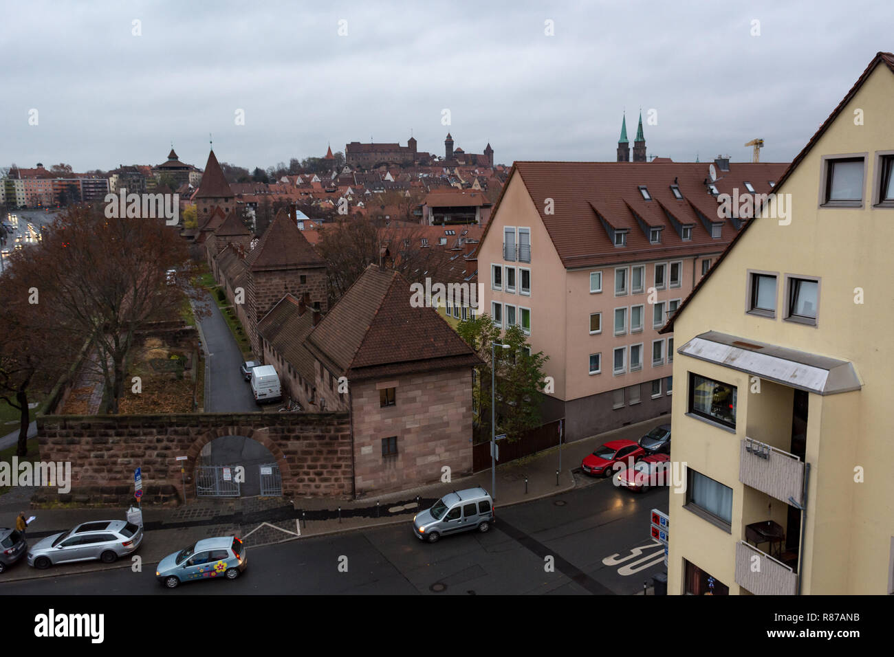 Panoramic rooftop view of medieval city with castle rising above Stock ...