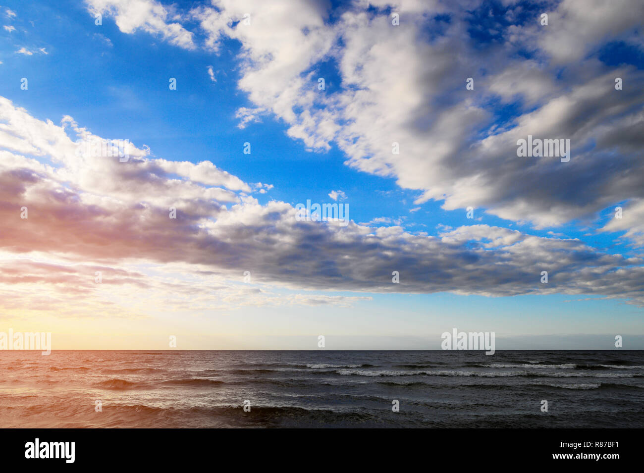 Baltic sea with scenic cumulus and stratocumulus clouds on the sky. Picturesque summer seascape. Pomerania, Gdansk bay, northern Poland. Stock Photo